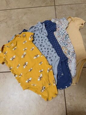 Carter’s 
Includes five short-sleeve baby bodysuits for easy outfit rotation
